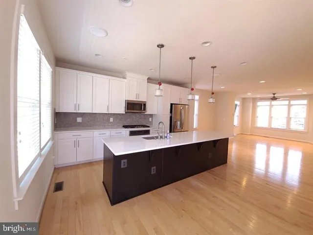 a front view of a residential apartment building with a yard