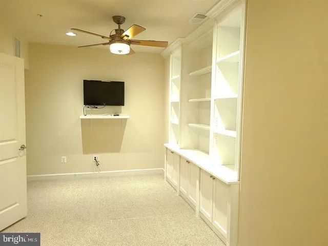 a white toilet sitting next to a shower