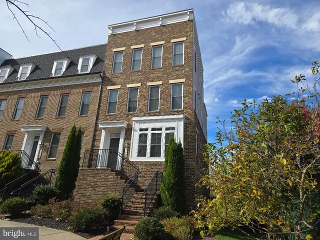 front view of a house with a tree