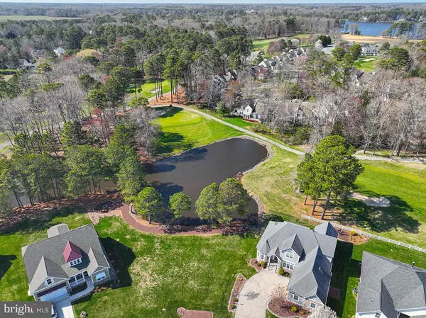 an aerial view of a house with a swimming pool yard and outdoor seating