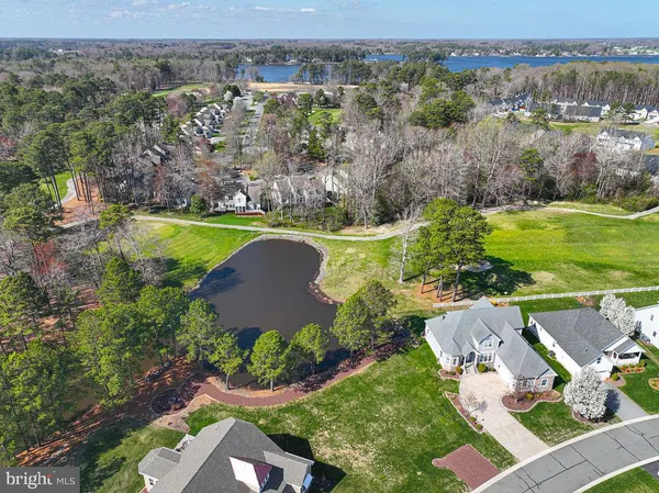 an aerial view of a house with garden space and outdoor seating