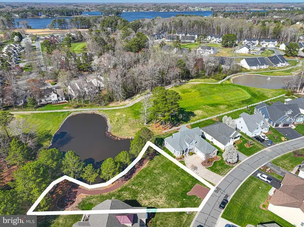 an aerial view of residential house with outdoor space and swimming pool
