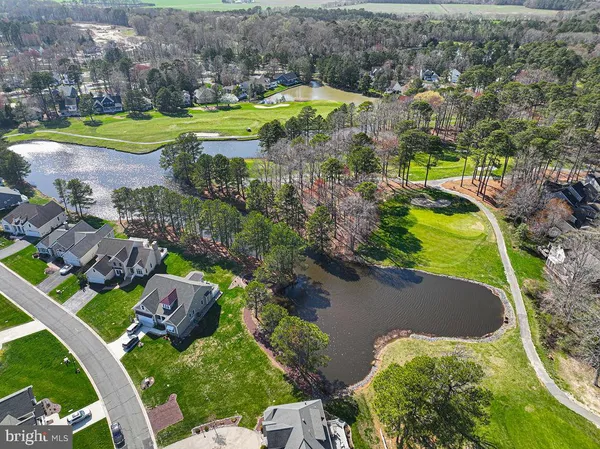 an aerial view of a house with a swimming pool