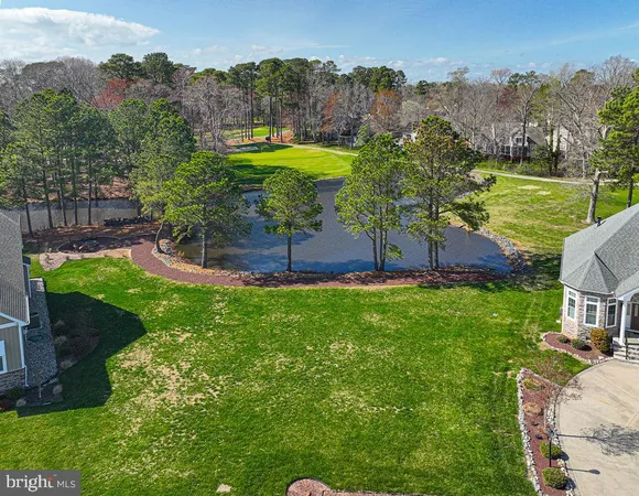 an aerial view of a house with garden space and outdoor seating