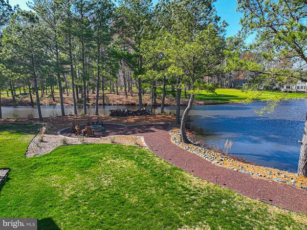 a view of a backyard with swimming pool