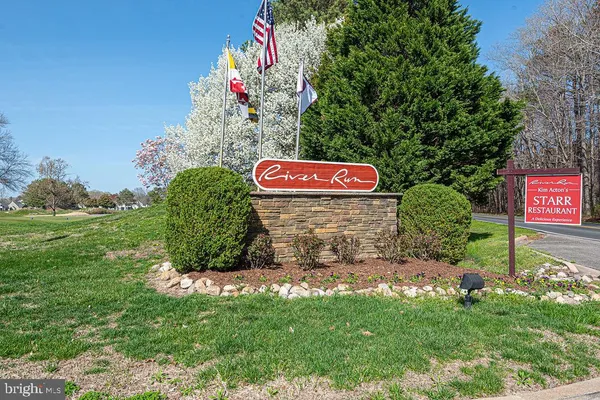 a view of sign board and green space