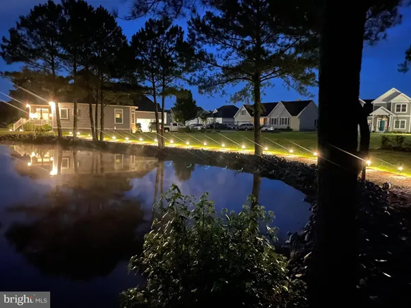 a view of swimming pool from a lake view