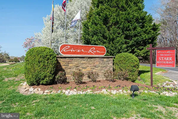 a street sign that is sitting in the grass