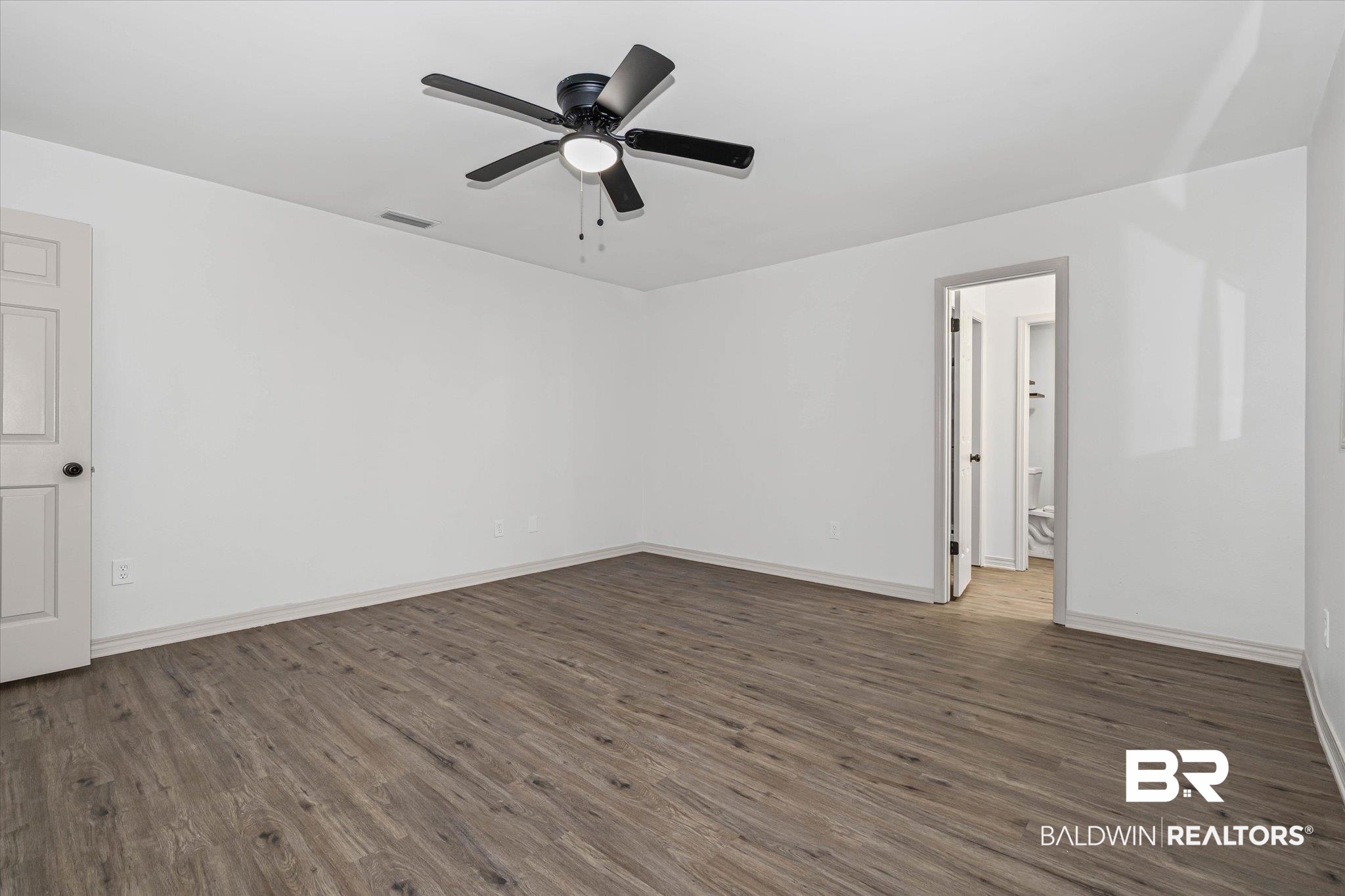 3655 Claridge Road South Mobile, AL 36608 - Photo 16 of 32 Empty room featuring dark wood-style flooring and ceiling fan