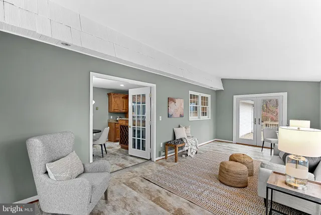 a spacious bedroom with a bed and a chandelier