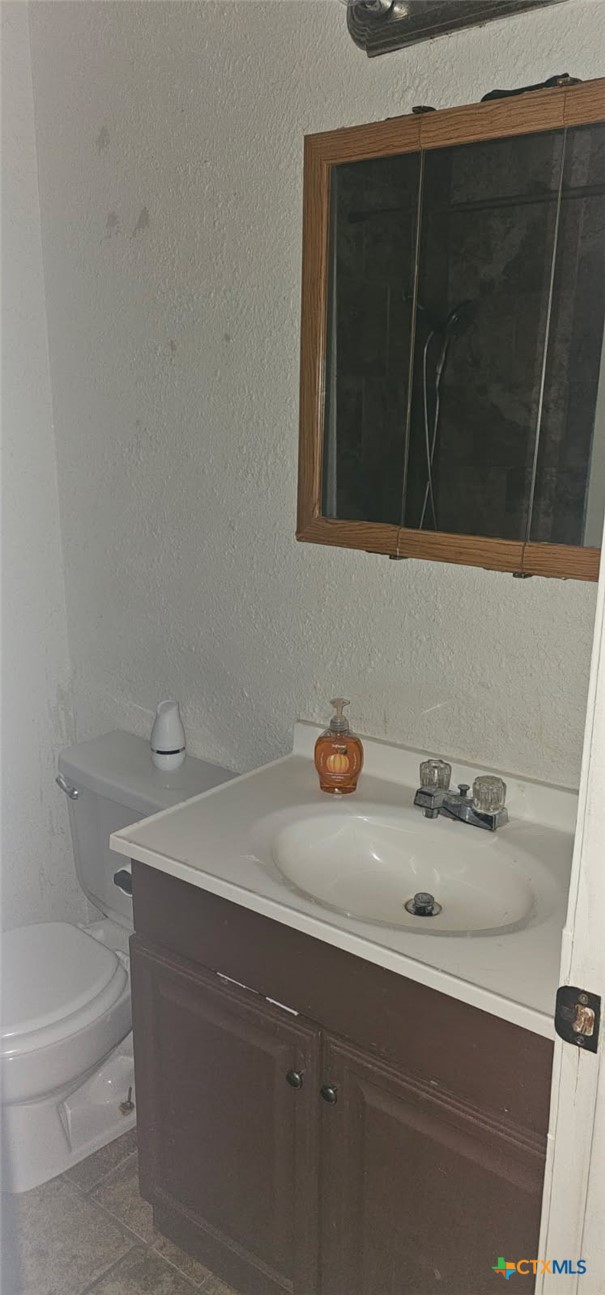 12 Sunset Drive Lampasas, TX 76550 - Photo 5 of 25 a bathroom with a sink and a toilet
