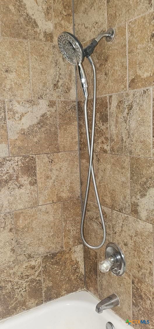 12 Sunset Drive Lampasas, TX 76550 - Photo 10 of 25 a bathroom with a granite countertop shower