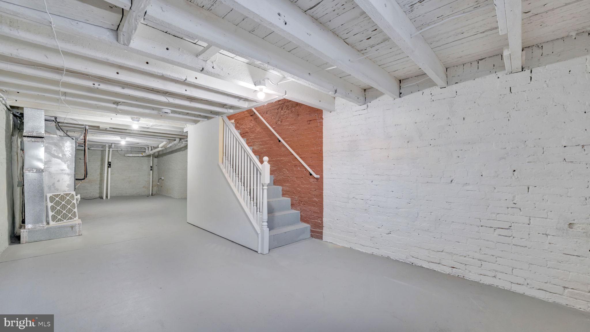 307 South Smallwood Street Baltimore, MD 21223 - Photo 15 of 19 a view of a hallway with staircase