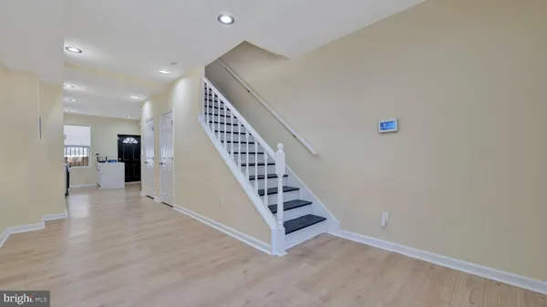 a view of wooden floor and windows in a room