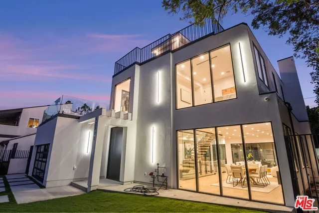 a front view of a building with a yard