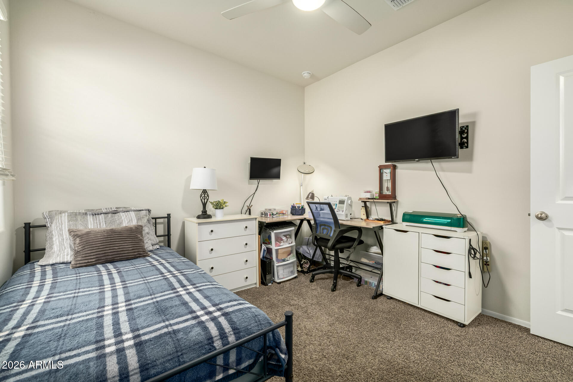 9471 Greenhouse Road Florence, AZ 85132 - Photo 15 of 22 a bedroom with a bed and a flat screen tv