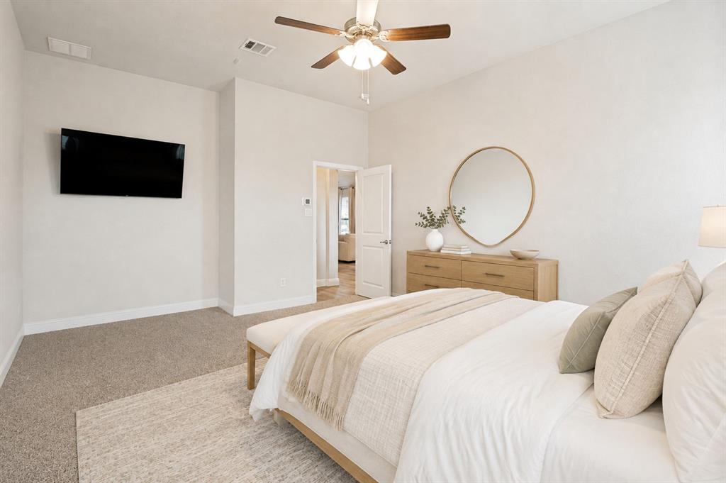 617 Mesquite Grove Road Midlothian, TX 76065 - Photo 16 of 25 Carpeted flooring, ceiling fan, white paneled door, and neutral wall tones