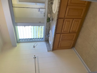 27-641 Ka'ie'ie Road Papaikou, HI 96781 - Photo 16 of 28 a bathroom with a granite countertop sink and a mirror