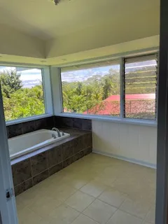 a bathroom with a large window