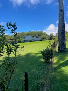 a view of a lake with a yard