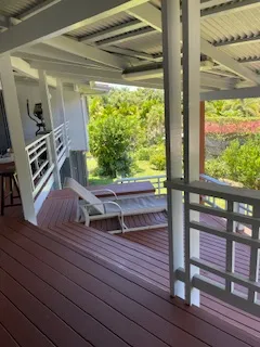 a view of a room with wooden floor and windows
