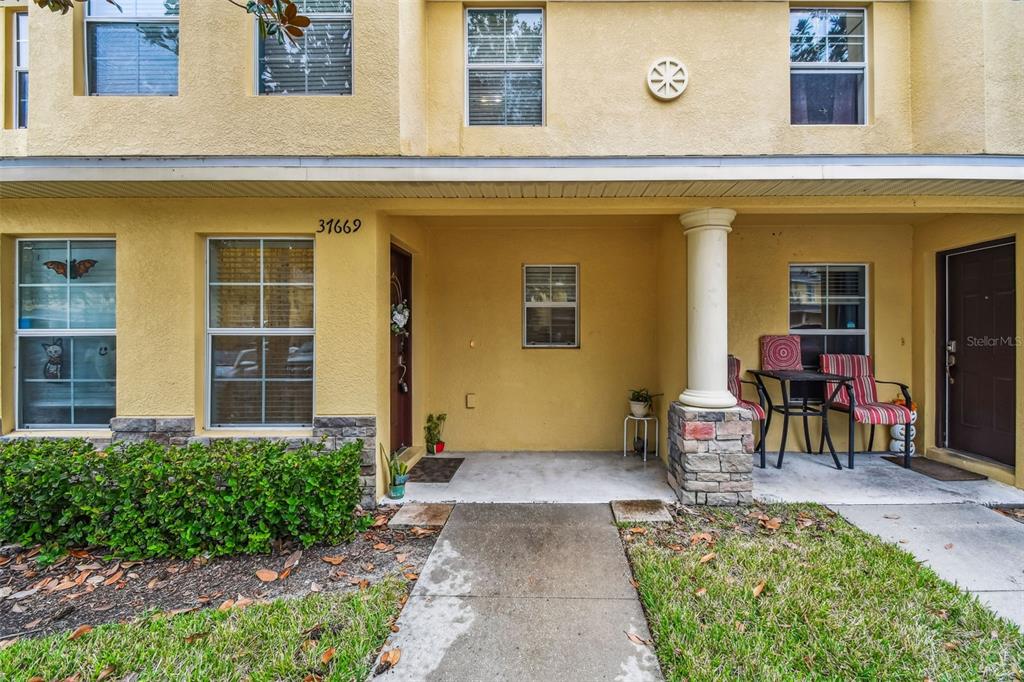 37669 Aaralyn Road Zephyrhills, FL 33542 - Photo 1 of 1 a view of a house with outdoor seating