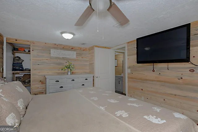 a view of living room with furniture and flat screen tv