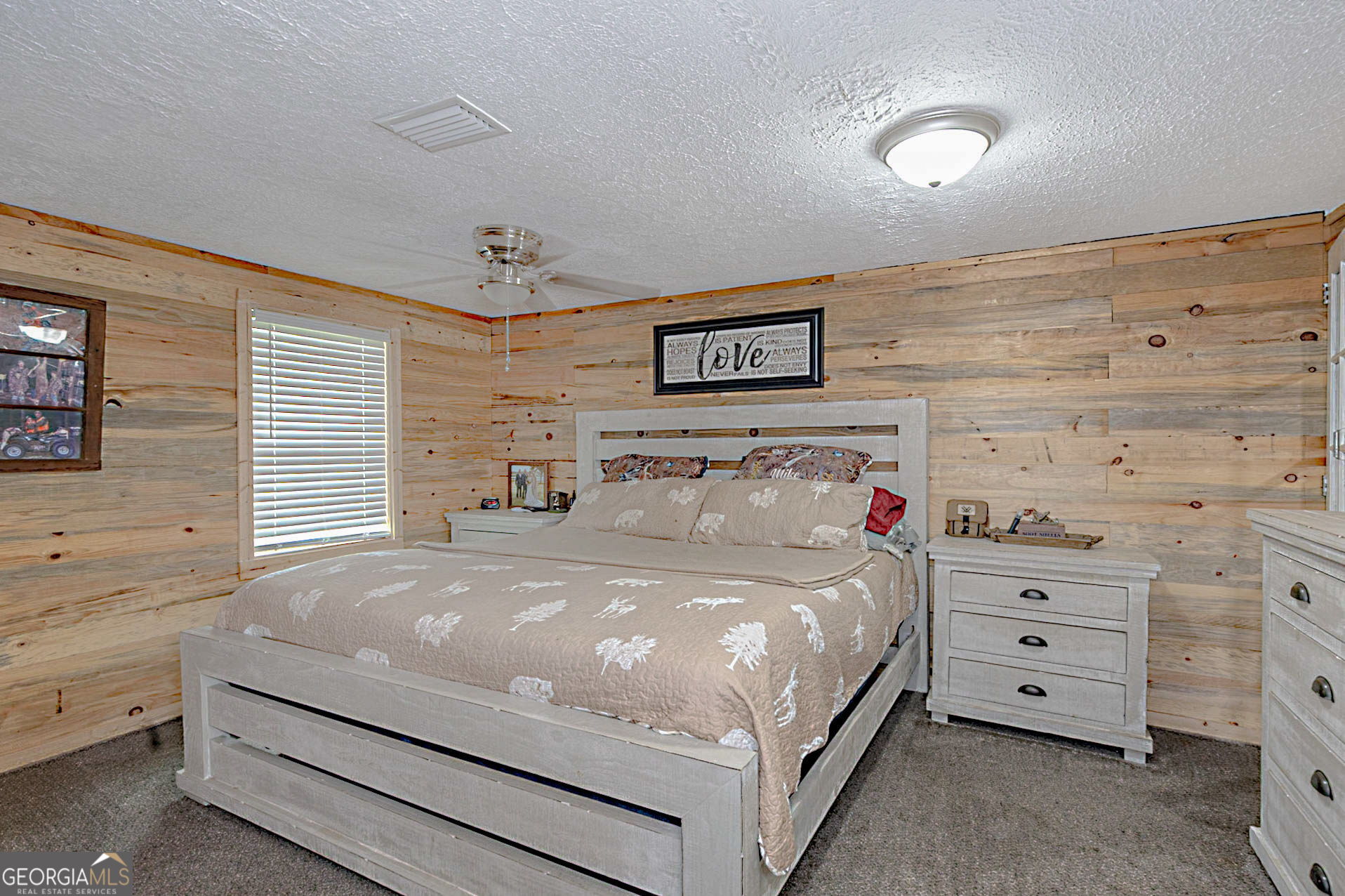 1455 McAllister Road Buena Vista, GA 31803 - Photo 16 of 45 a large bed sitting in a bedroom next to a window