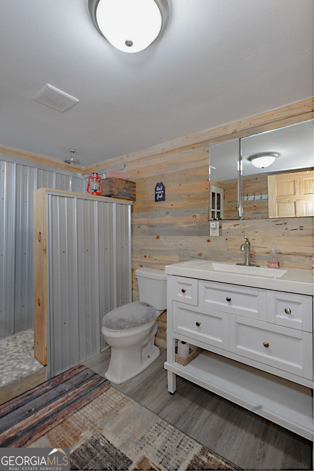 1455 McAllister Road Buena Vista, GA 31803 - Photo 18 of 45 a bathroom with a toilet a sink and mirror