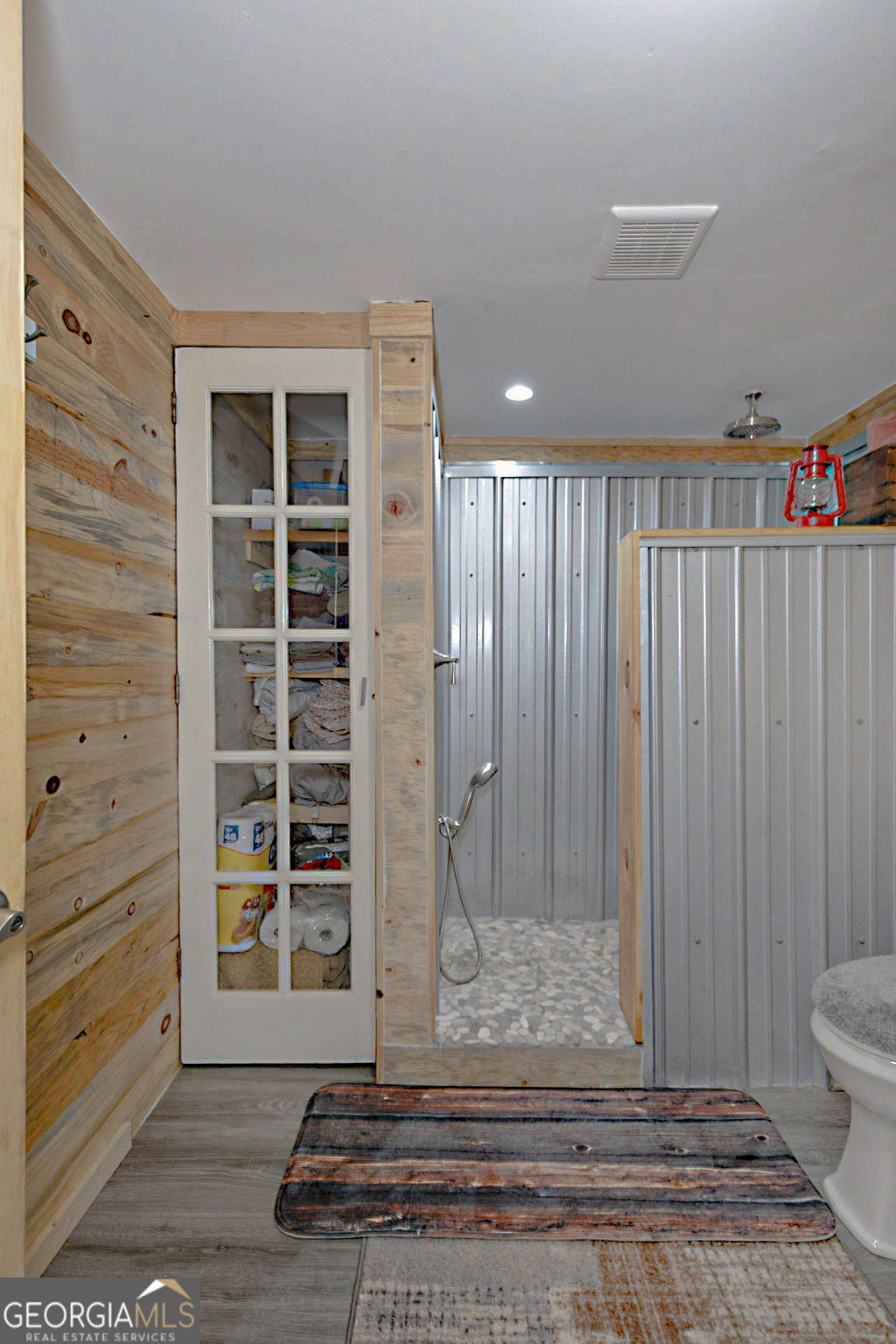 1455 McAllister Road Buena Vista, GA 31803 - Photo 19 of 45 a view of water heater room with wooden floor
