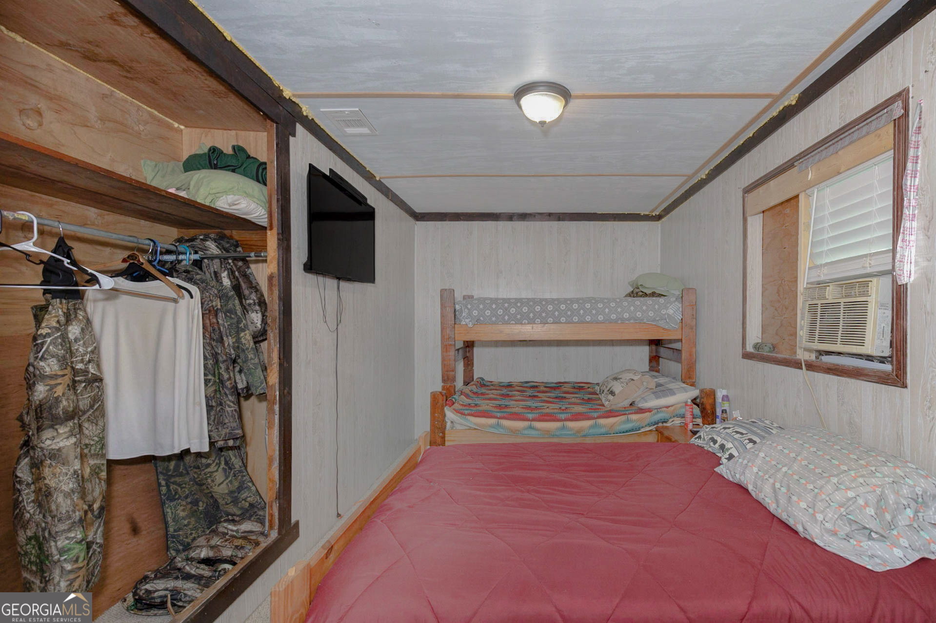 1455 McAllister Road Buena Vista, GA 31803 - Photo 21 of 45 a bedroom with a bed and a window