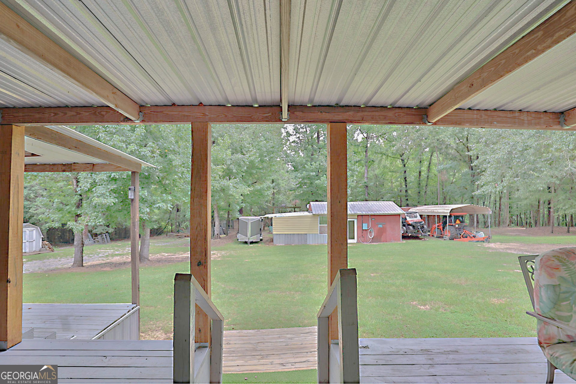1455 McAllister Road Buena Vista, GA 31803 - Photo 23 of 45 a view of a porch with furniture and garden