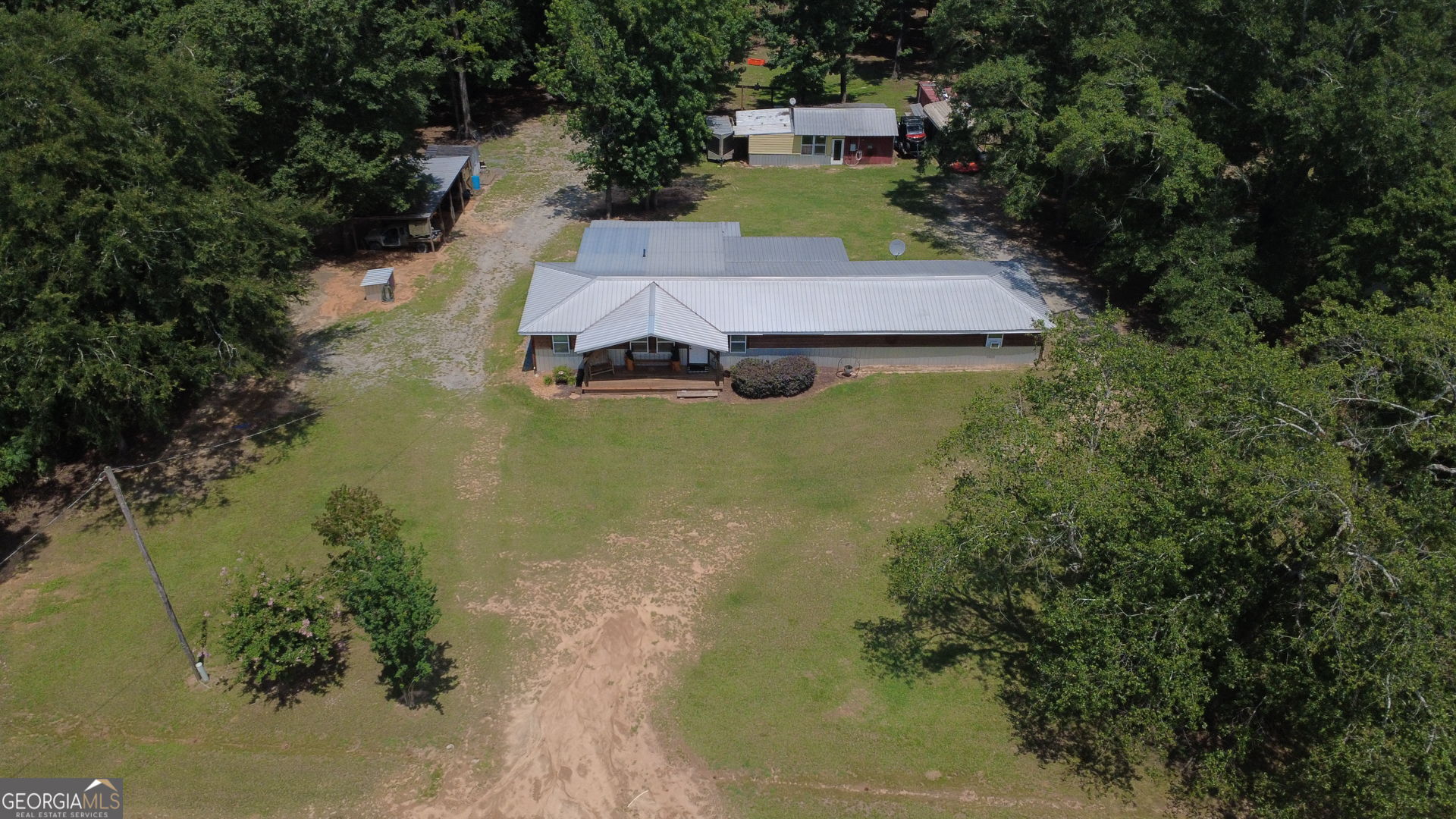 1455 McAllister Road Buena Vista, GA 31803 - Photo 28 of 45 an aerial view of a house with a yard basket ball court and outdoor seating