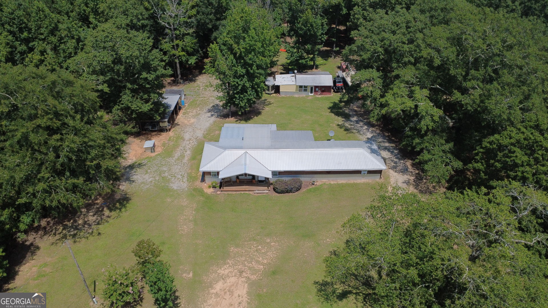 1455 McAllister Road Buena Vista, GA 31803 - Photo 29 of 45 an aerial view of a house with a yard basket ball court and outdoor seating