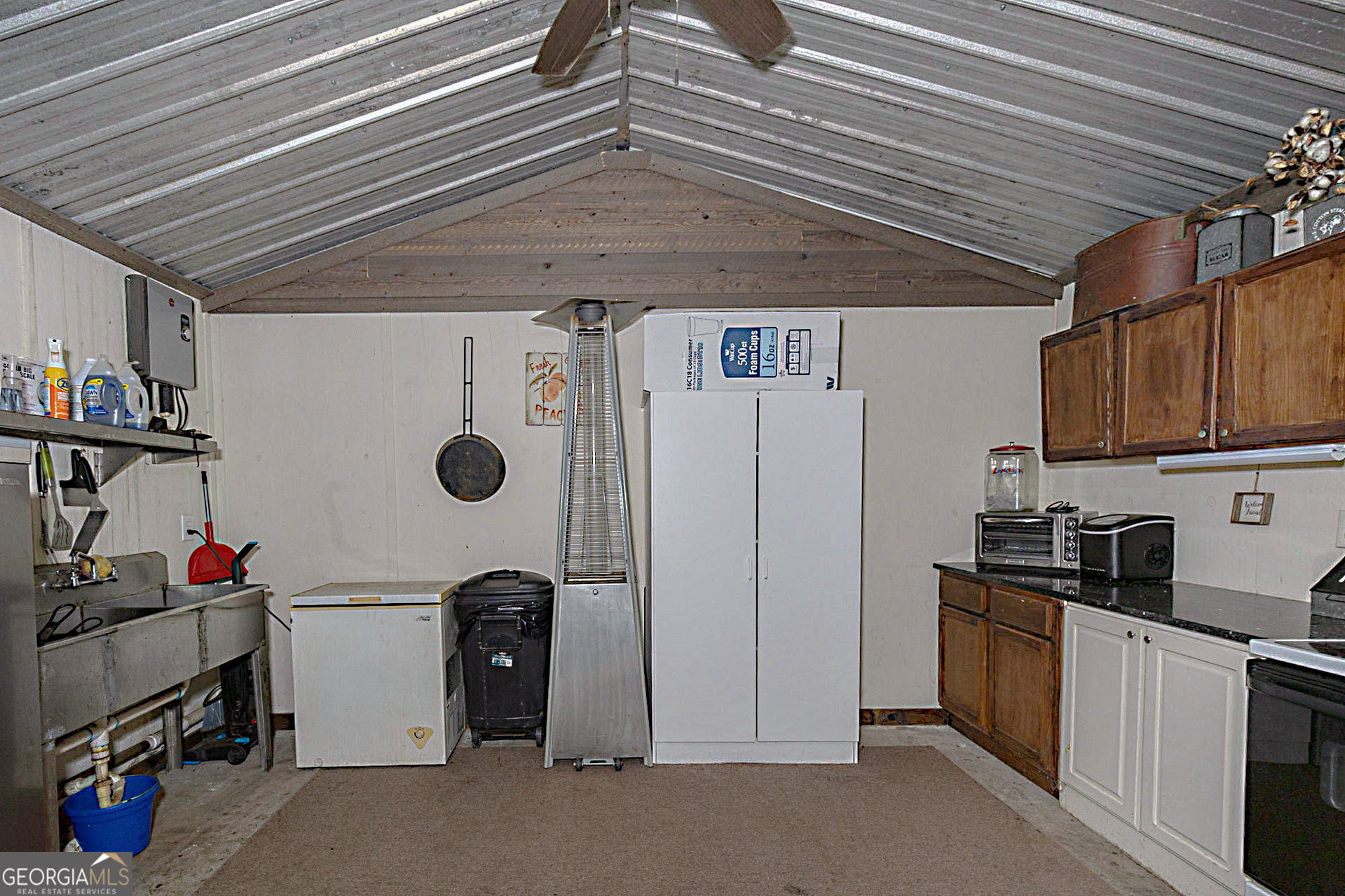 1455 McAllister Road Buena Vista, GA 31803 - Photo 35 of 45 a view of a storage & utility room with washer and dryer