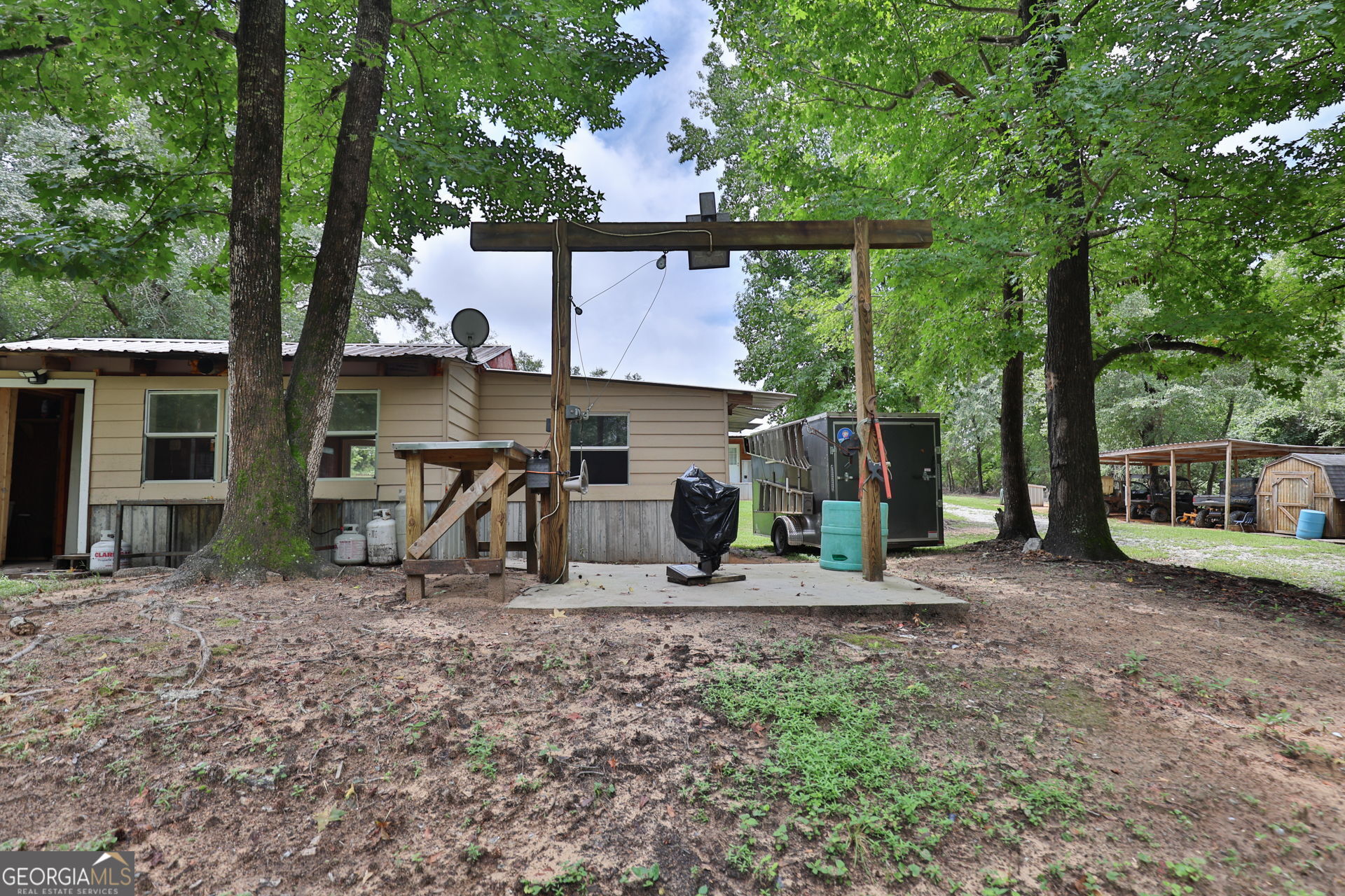 1455 McAllister Road Buena Vista, GA 31803 - Photo 37 of 45 a view of a house with backyard and sitting area