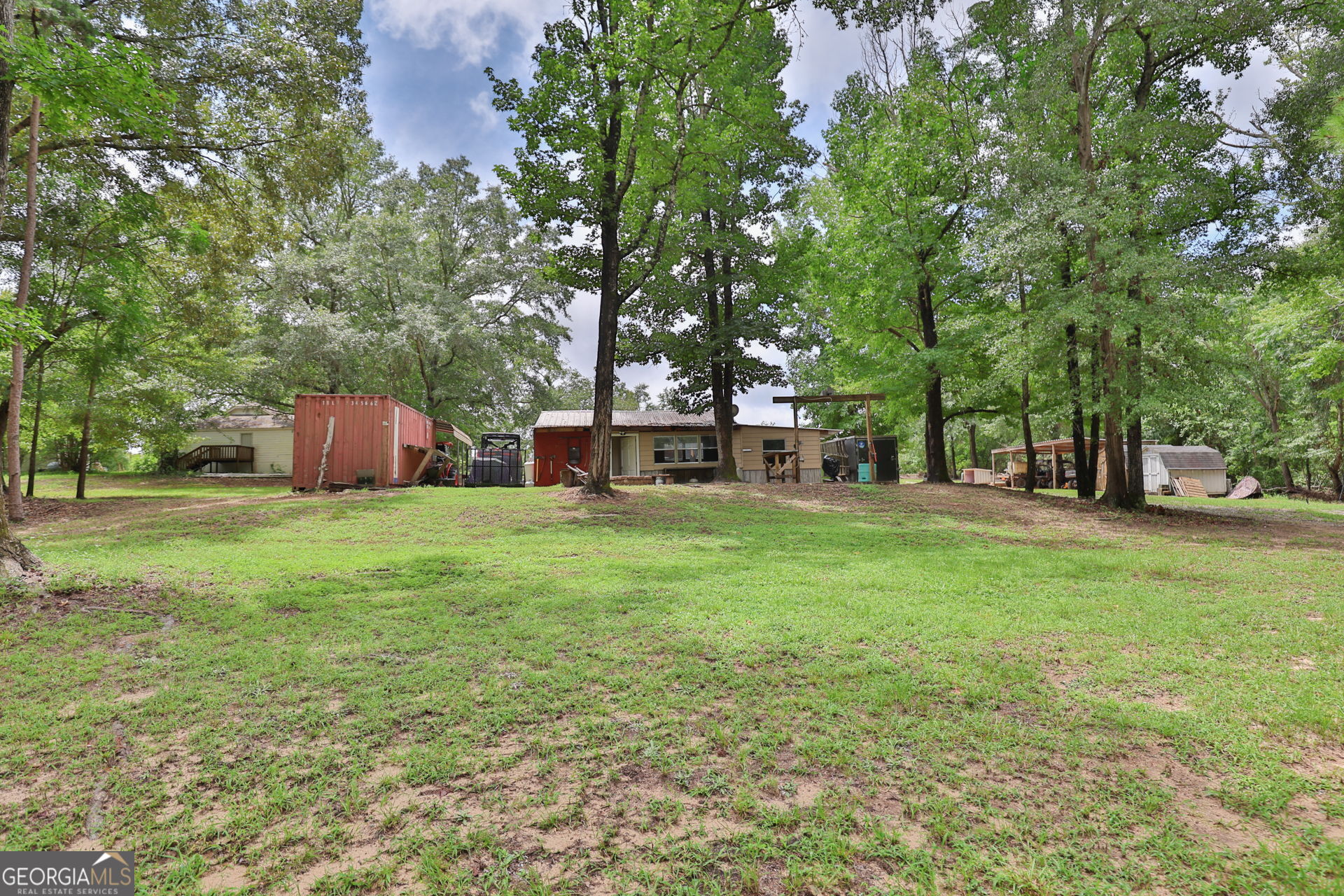 1455 McAllister Road Buena Vista, GA 31803 - Photo 41 of 45 a backyard of a house with table and chairs