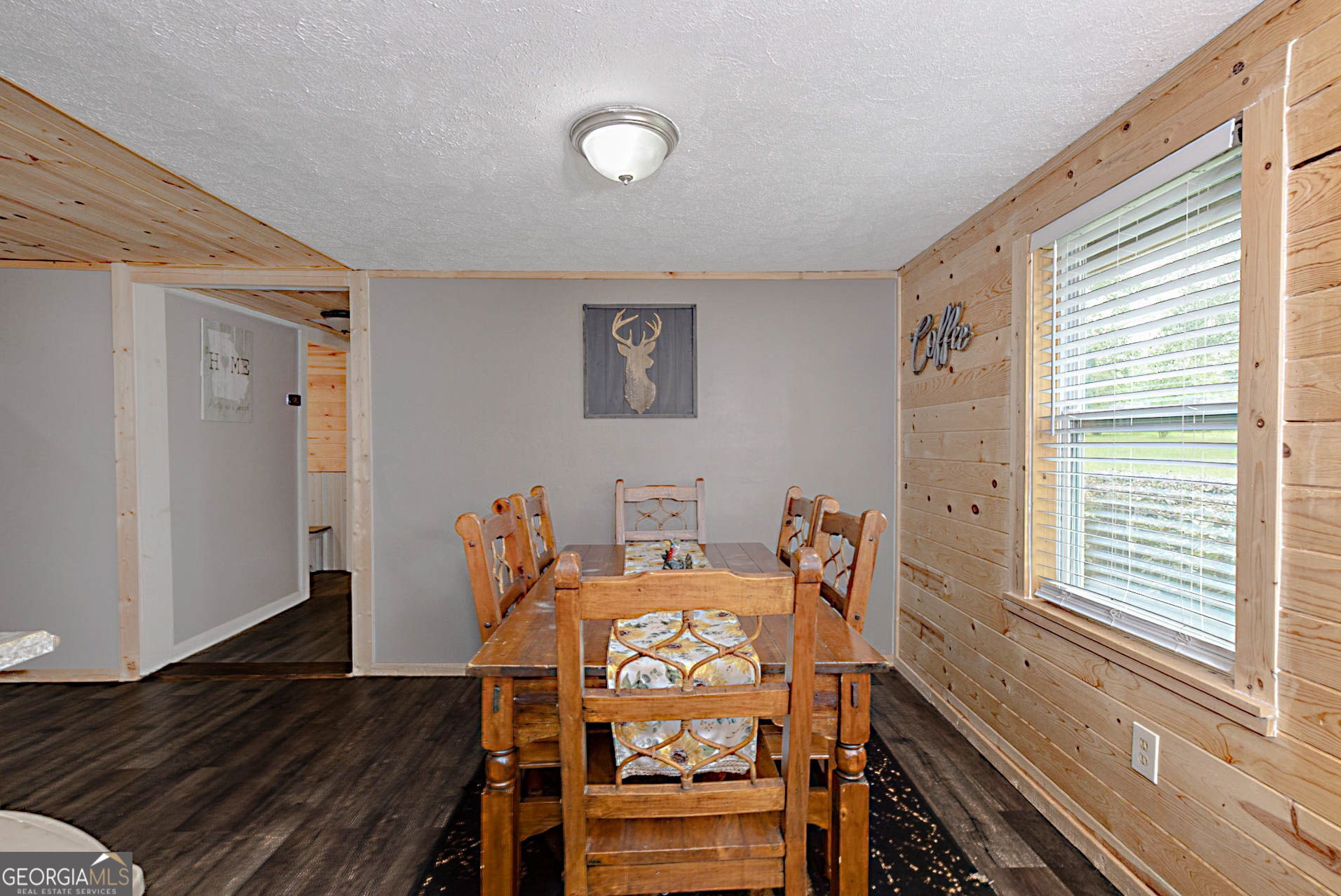 1455 McAllister Road Buena Vista, GA 31803 - Photo 5 of 45 a view of a dining room with furniture a chandelier and wooden floor