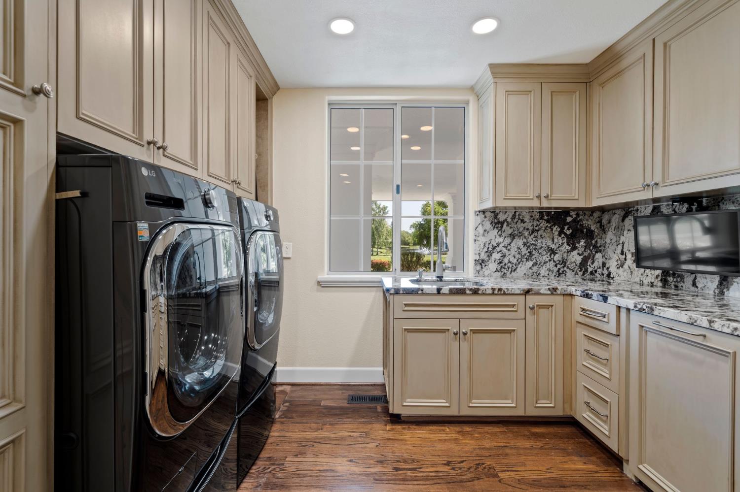 10676 Wilton Road Elk Grove, CA 95624 - Photo 19 of 71 a kitchen with stainless steel appliances granite countertop a stove and a refrigerator