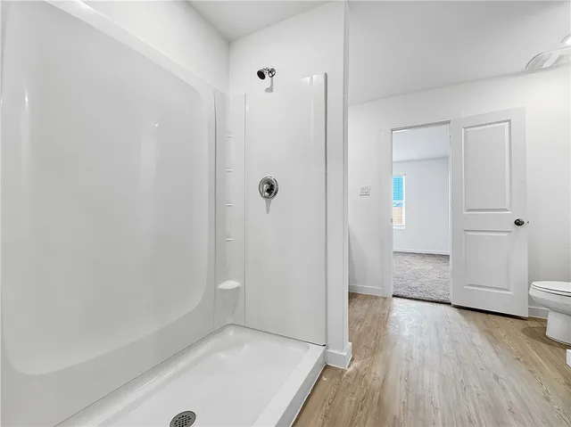 a view of an empty room with a fireplace