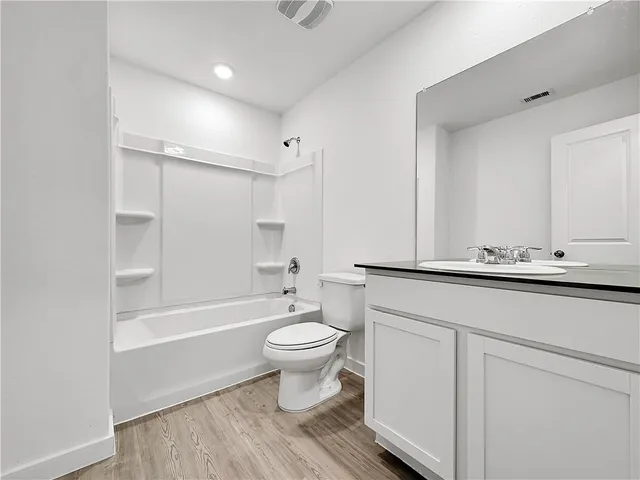 a view of backyard with large trees