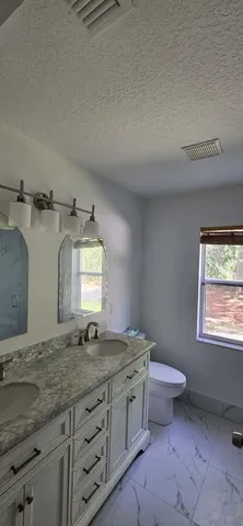 a spacious bathroom with a tub and shower