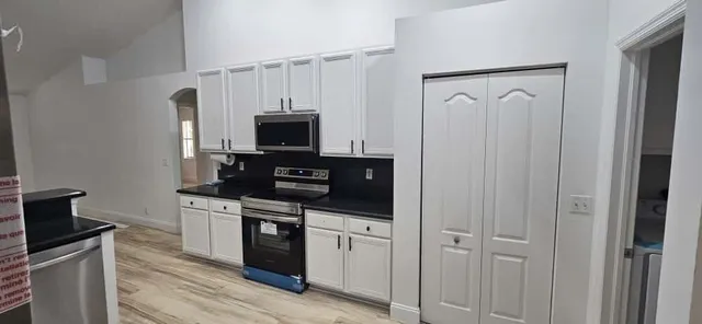 a bathroom with a toilet and a mirror