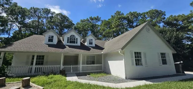 a front view of a house with garage