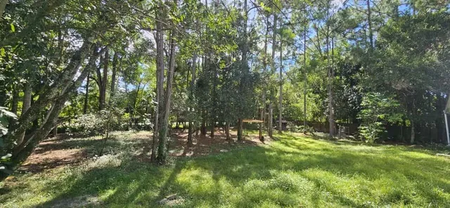 a view of kitchen with refrigerator sink and a stove