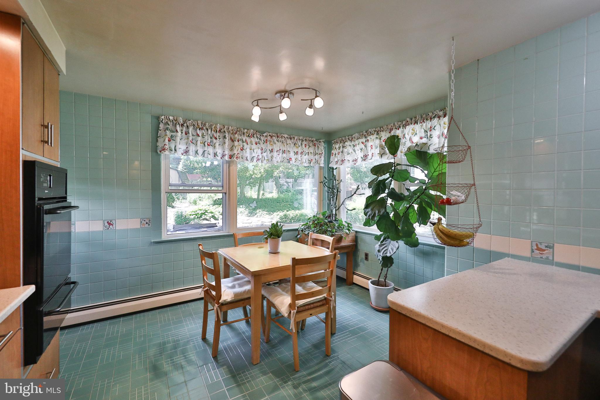720 Camberly Road Glenside, PA 19038 - Photo 15 of 29 Breakfast Room with stove and chandelier