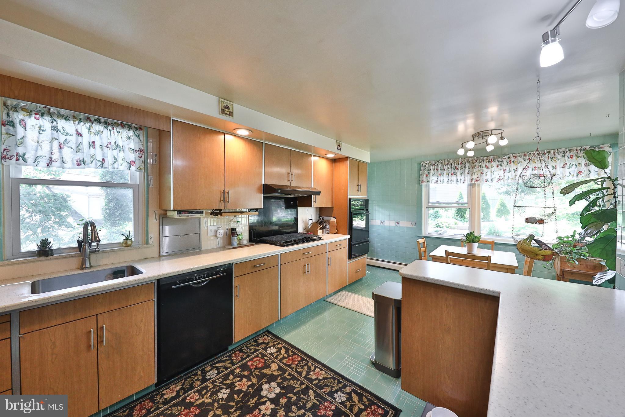 720 Camberly Road Glenside, PA 19038 - Photo 17 of 29 Kitchen with Corian Counters, Tile Floors