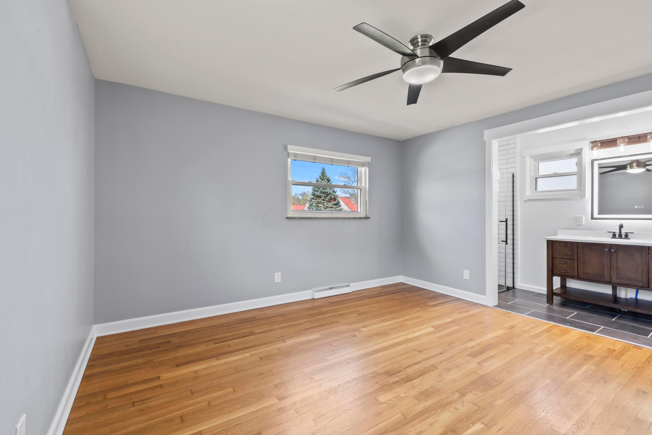 2209 Fishinger Road Columbus, OH 43221 - Photo 17 of 39 Primary Suite with hardwood floors