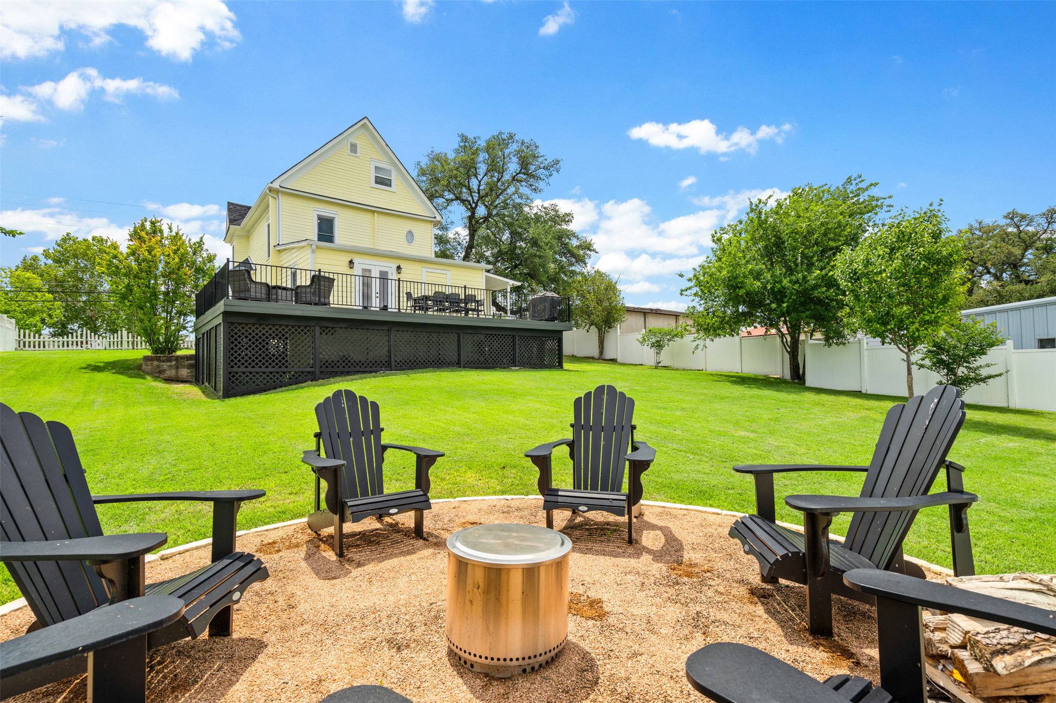 508 Main Street Marble Falls, TX 78654 - Photo 26 of 30 View of yard with a fenced backyard and an outdoor fire pit