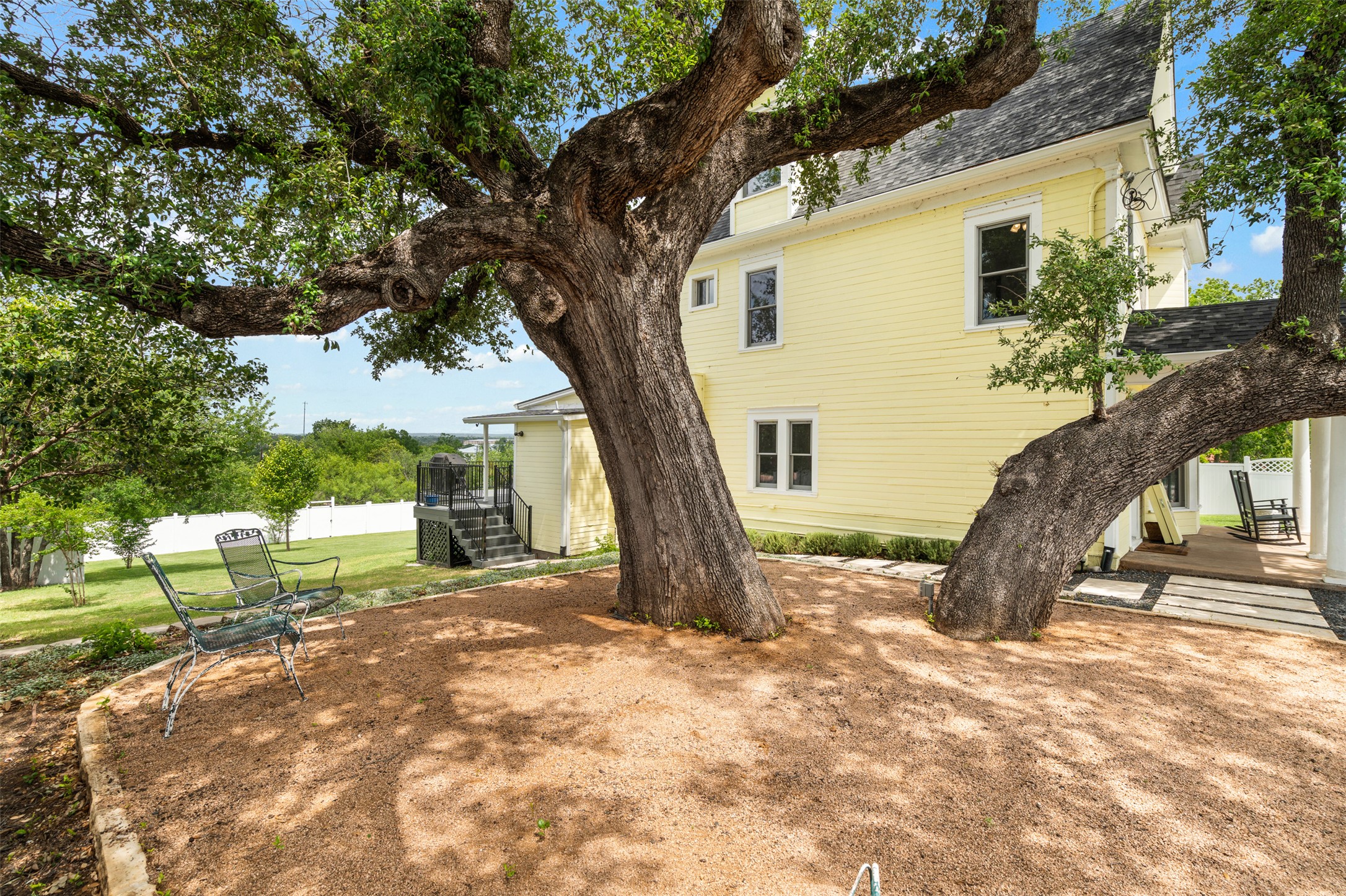 508 Main Street Marble Falls, TX 78654 - Photo 27 of 30 Side view of courtyard under a heritage oak.